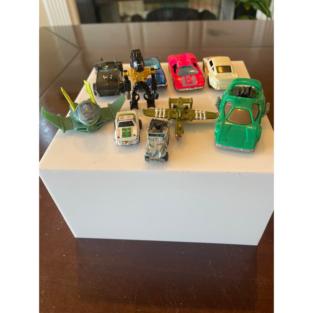 Lot of 10 various Hot Wheels and other assorted vehicles car plane robot